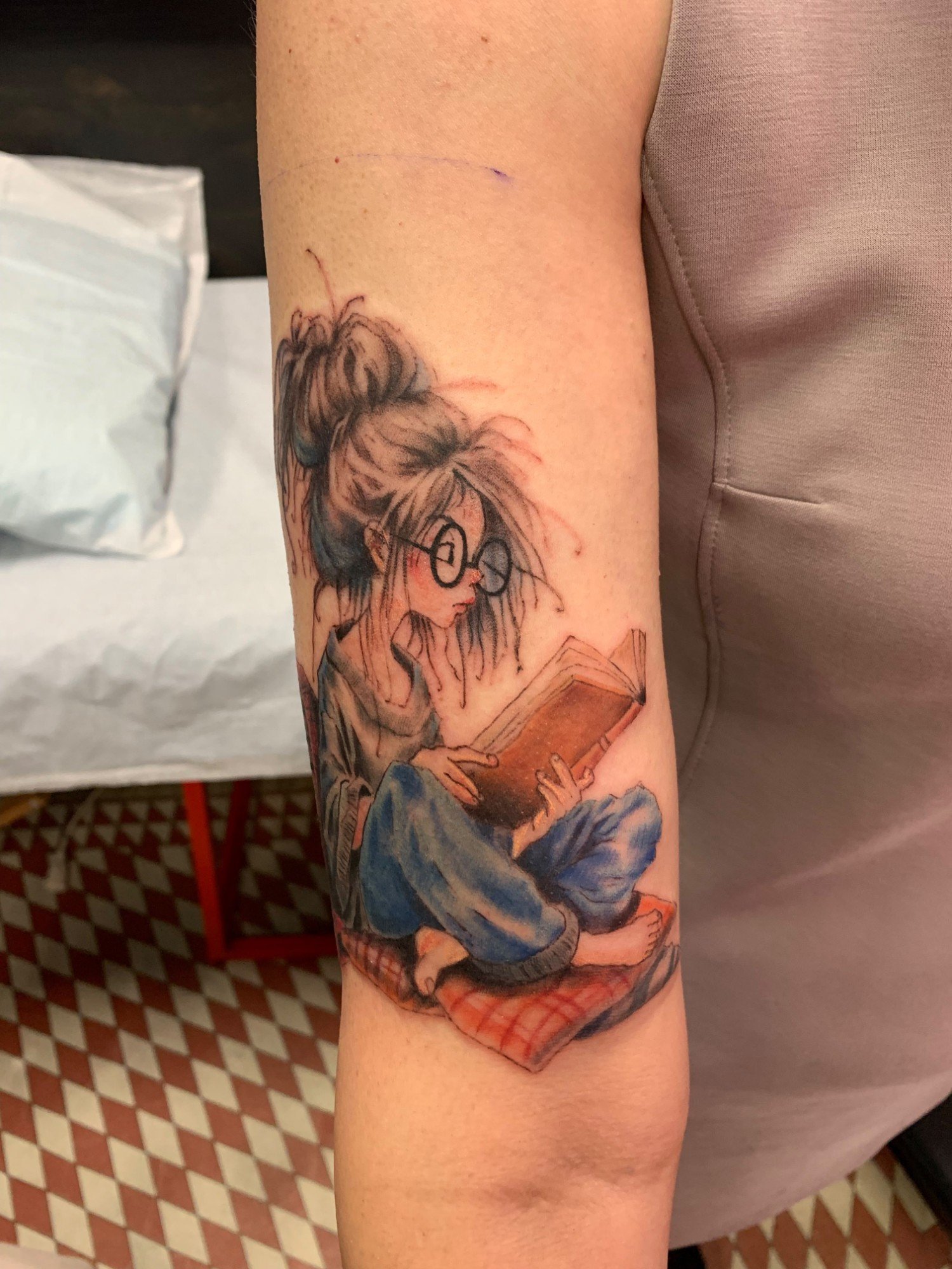 Girl reading a book tattoo in color